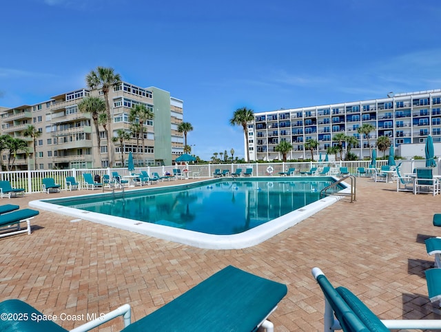 view of swimming pool with a patio area