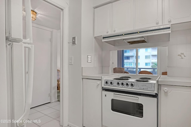 kitchen featuring light countertops, electric range, white cabinets, and under cabinet range hood