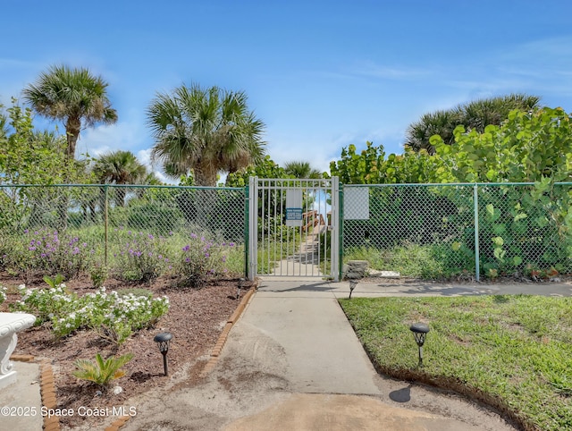 view of gate featuring fence