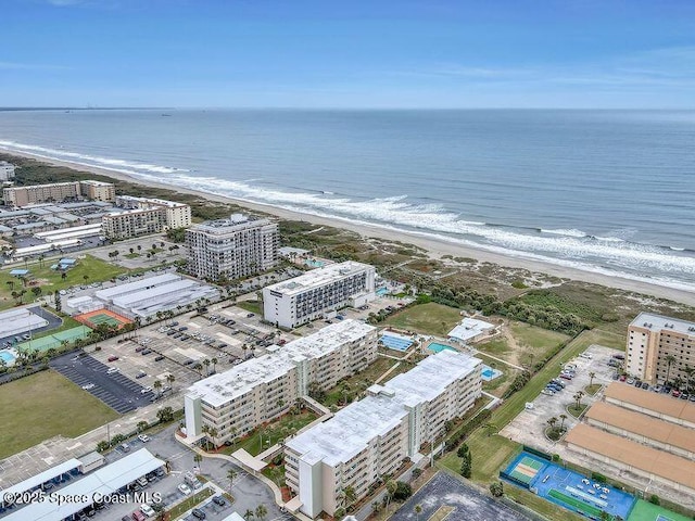 birds eye view of property featuring a water view and a view of the beach