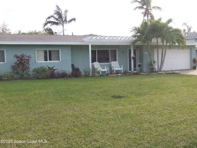 ranch-style home featuring a front lawn and a garage