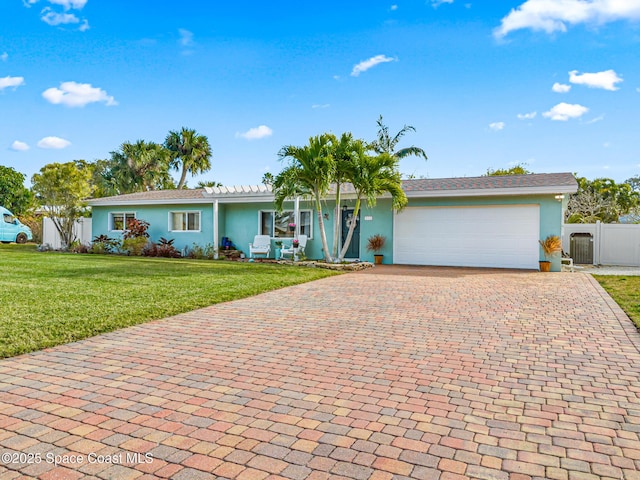 ranch-style home with a garage and a front yard