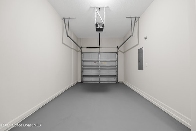 garage featuring a garage door opener and electric panel