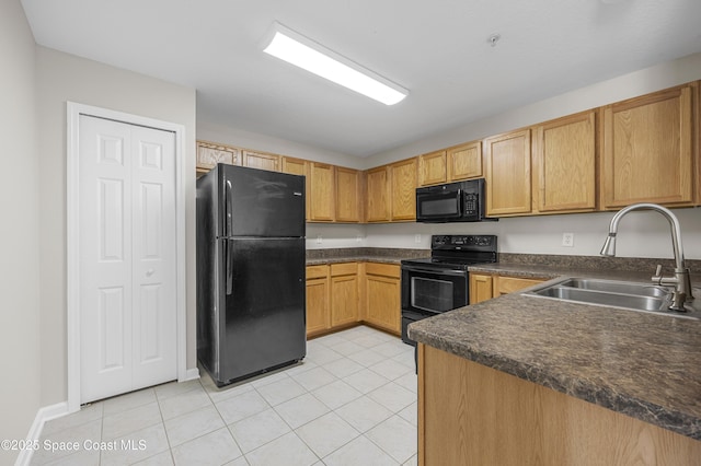 kitchen featuring light tile patterned flooring, sink, kitchen peninsula, and black appliances