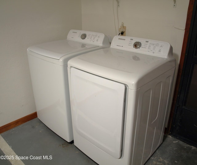 laundry area with independent washer and dryer