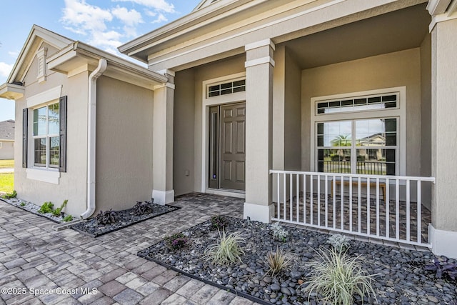 7690 Kerrington Dr, Melbourne, FL 32940 - property entrance with a porch