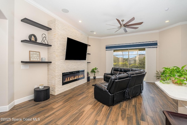 7690 Kerrington Dr, Melbourne, FL 32940 - living room with a stone fireplace, ornamental molding, dark hardwood / wood-style floors, and ceiling fan