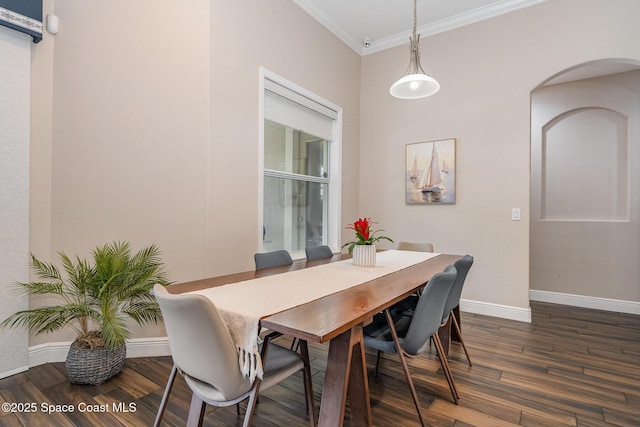 7690 Kerrington Dr, Melbourne, FL 32940 - dining area featuring crown molding and dark hardwood / wood-style floors