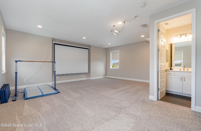 7690 Kerrington Dr, Melbourne, FL 32940 - cinema room featuring sink and carpet floors