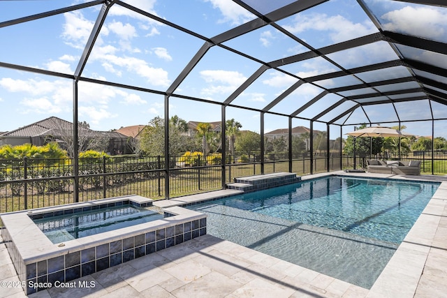 7690 Kerrington Dr, Melbourne, FL 32940 - view of pool with an in ground hot tub, a patio area, and glass enclosure