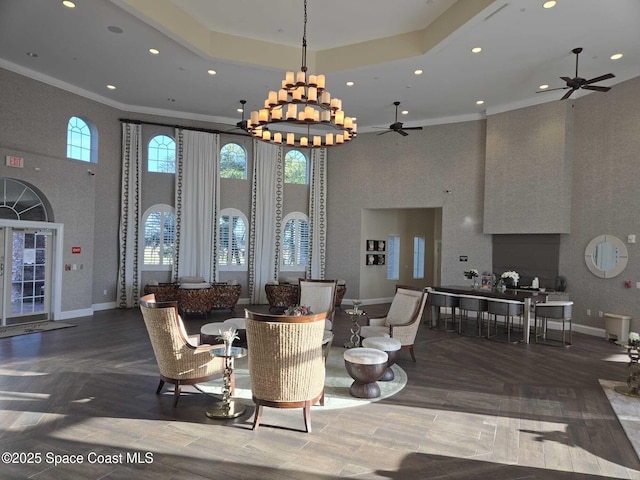7690 Kerrington Dr, Melbourne, FL 32940 - interior space featuring a tray ceiling, crown molding, ceiling fan, and a high ceiling