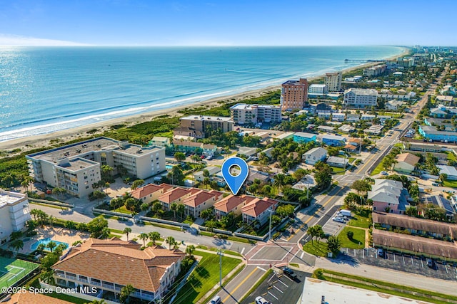 drone / aerial view with a water view and a view of the beach