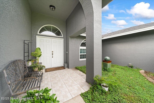 entrance to property with a patio