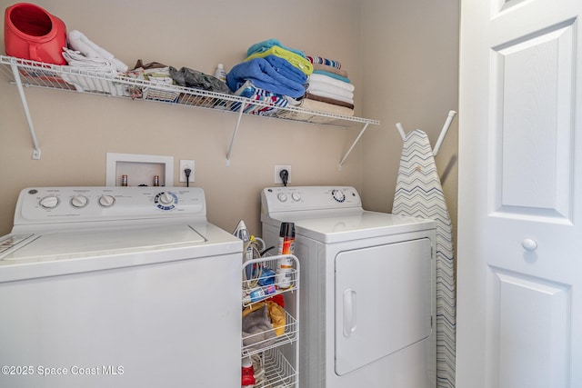 laundry room featuring washing machine and dryer