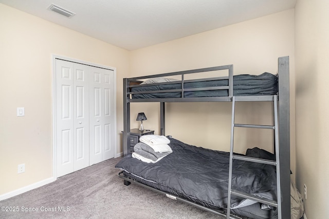 carpeted bedroom with a closet