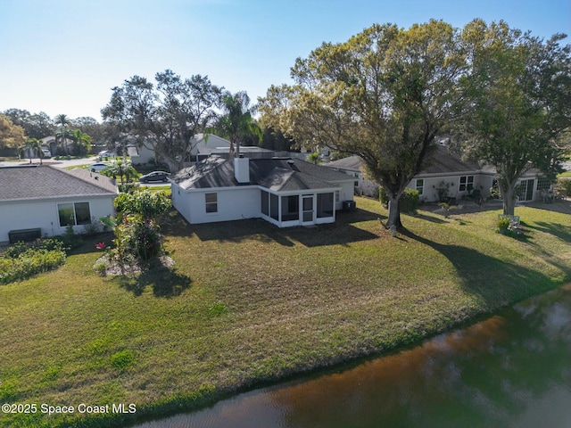 drone / aerial view featuring a water view