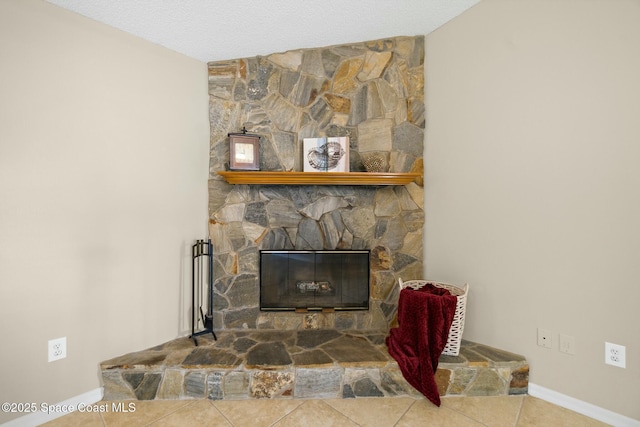 room details with a fireplace and a textured ceiling