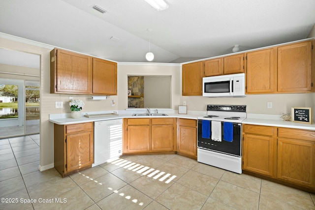 kitchen with sink, white appliances, light tile patterned floors, ornamental molding, and vaulted ceiling