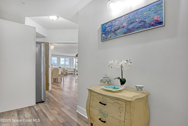 hall with light hardwood / wood-style floors