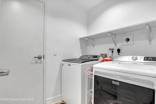 laundry room featuring washer and clothes dryer