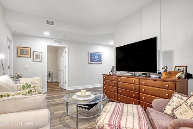 living room with light hardwood / wood-style flooring