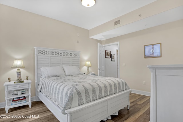 bedroom featuring hardwood / wood-style flooring