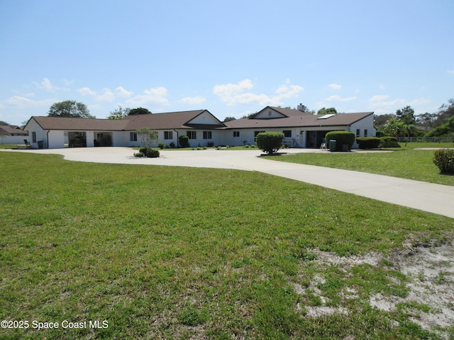 ranch-style house with a front lawn