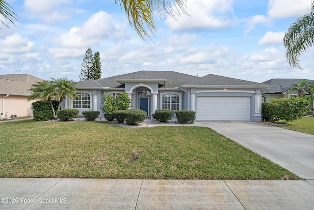 ranch-style house with a garage and a front lawn