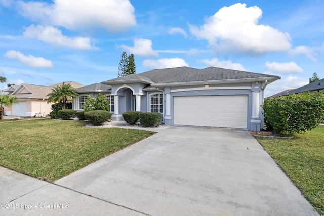 single story home featuring a front yard and a garage