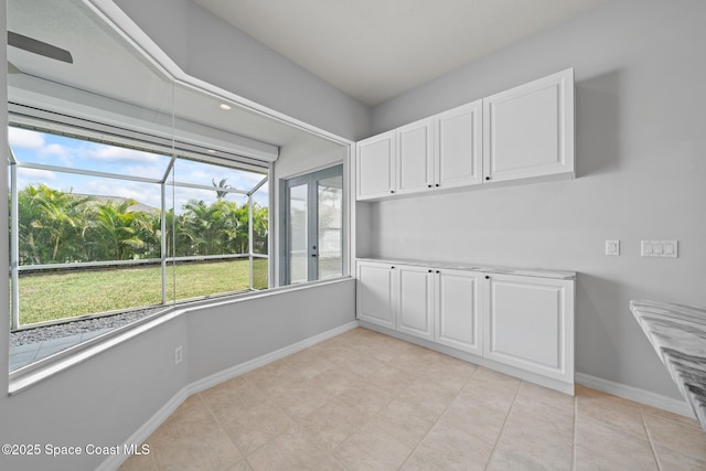 unfurnished dining area with light tile patterned floors