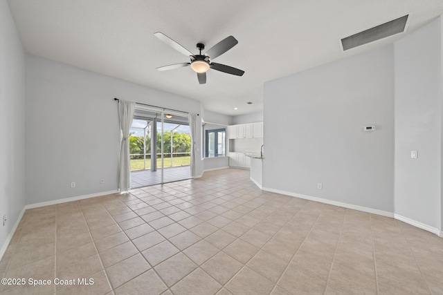 unfurnished living room with ceiling fan and light tile patterned floors