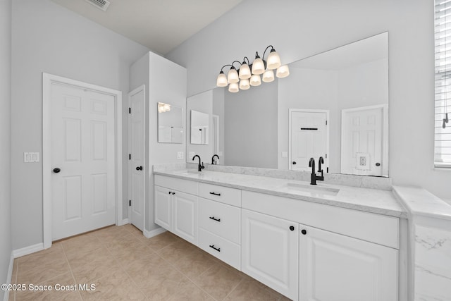 bathroom featuring tile patterned floors and vanity