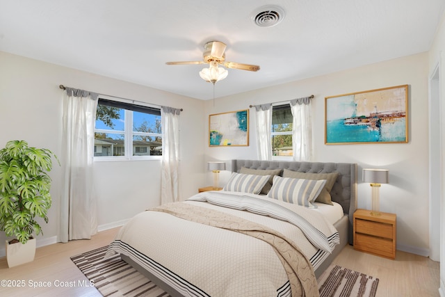 1008 Jersey St, Cocoa, FL 32927 - bedroom with multiple windows, light wood-type flooring, and a ceiling fan