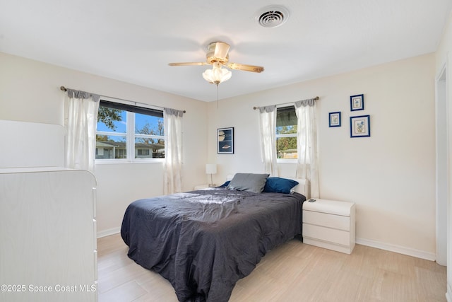1008 Jersey St, Cocoa, FL 32927 - bedroom with multiple windows and ceiling fan