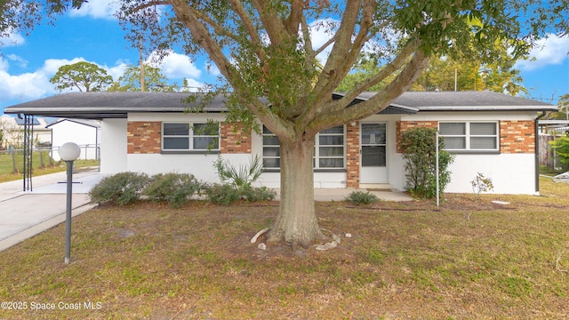 1008 Jersey St, Cocoa, FL 32927 - single story home featuring concrete block siding, an attached carport, concrete driveway, and brick siding