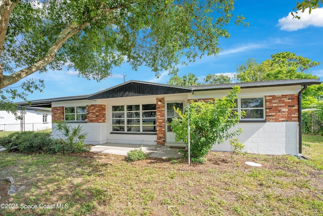 1008 Jersey St, Cocoa, FL 32927 - back of house with concrete block siding and brick siding