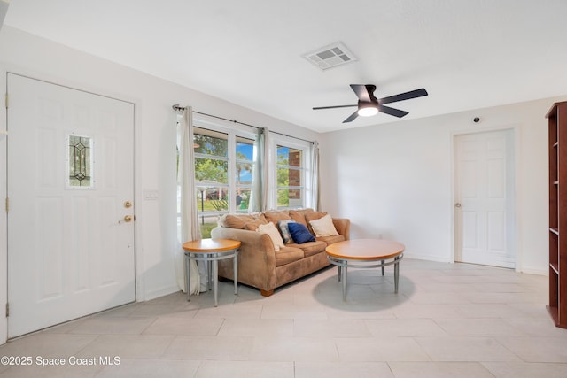 1008 Jersey St, Cocoa, FL 32927 - living room with a ceiling fan and baseboards