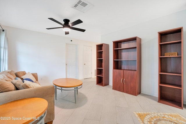 1008 Jersey St, Cocoa, FL 32927 - living room featuring a ceiling fan and baseboards