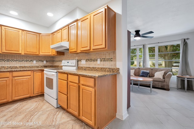 1008 Jersey St, Cocoa, FL 32927 - kitchen with white electric range, under cabinet range hood, ceiling fan, tasteful backsplash, and recessed lighting