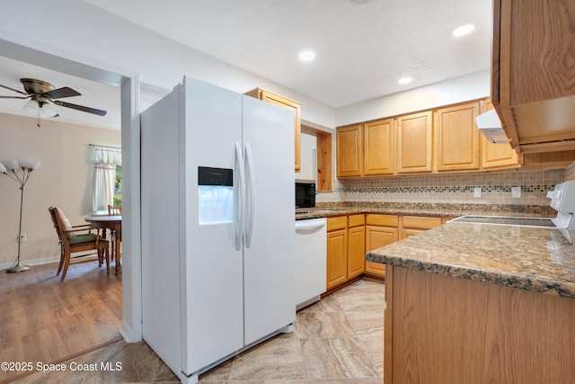 1008 Jersey St, Cocoa, FL 32927 - kitchen with white appliances, backsplash, ceiling fan, under cabinet range hood, and recessed lighting