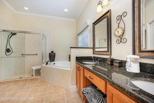 bathroom with tile patterned floors, vanity, ornamental molding, and independent shower and bath