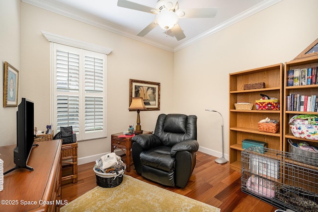 living area with ceiling fan, ornamental molding, and hardwood / wood-style flooring