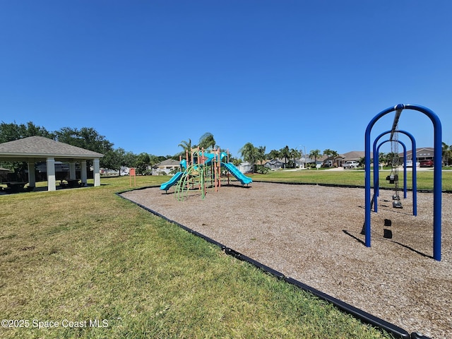 community jungle gym featuring a lawn and a gazebo