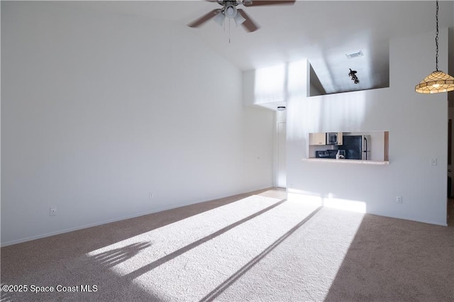 unfurnished living room with high vaulted ceiling, carpet, and ceiling fan