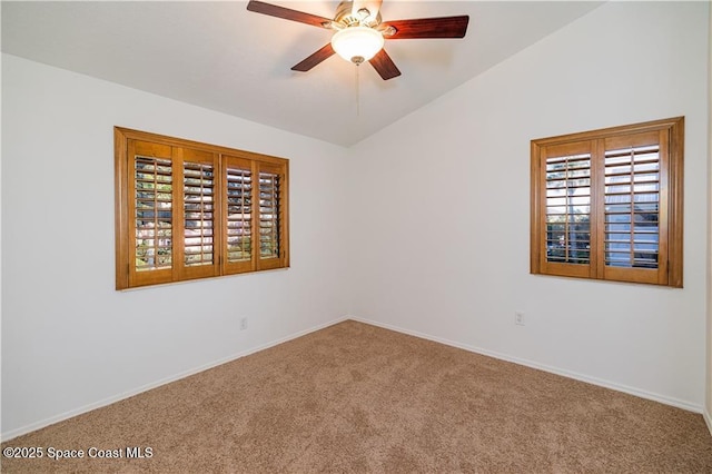 unfurnished room with lofted ceiling, ceiling fan, and carpet floors