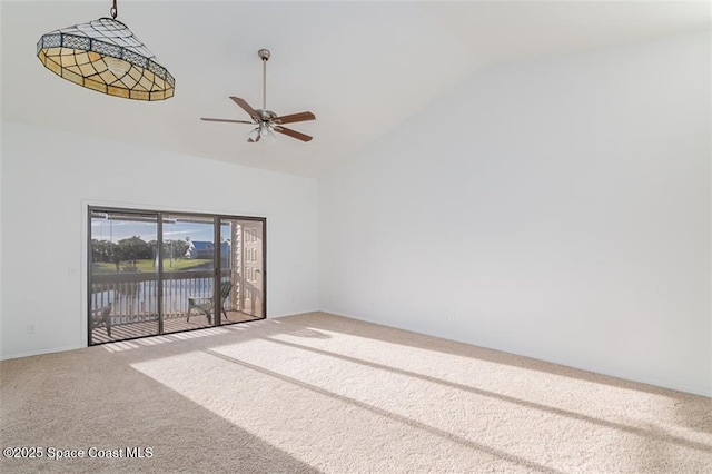 unfurnished room with high vaulted ceiling, carpet, and ceiling fan