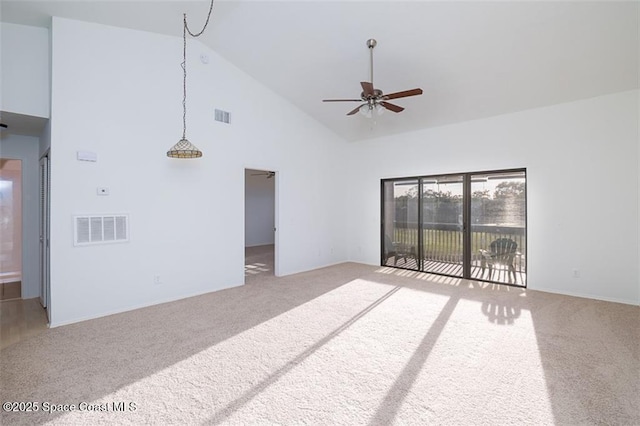 living room featuring high vaulted ceiling, ceiling fan, and carpet flooring