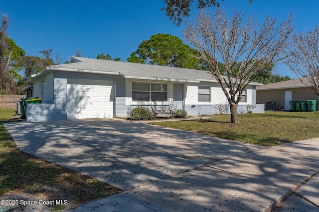 ranch-style home with a garage and a front yard