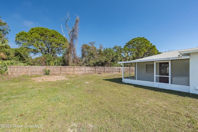 view of yard featuring a sunroom