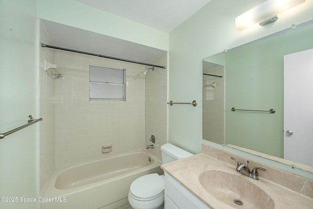 full bathroom with tiled shower / bath combo, vanity, and toilet